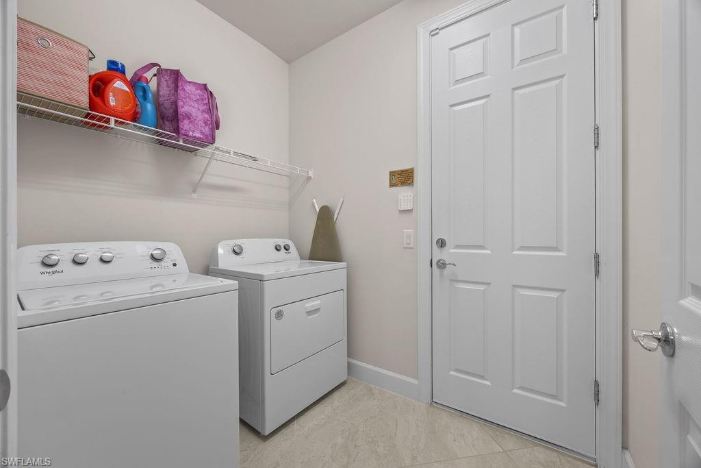 5931 Mayflower Way Ave Maria, FL 34142 - Photo 23 of 34 a utility room with dryer and washer