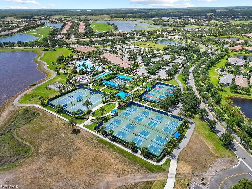 5931 Mayflower Way Ave Maria, FL 34142 - Photo 30 of 34 an aerial view of a pool and an outdoor space
