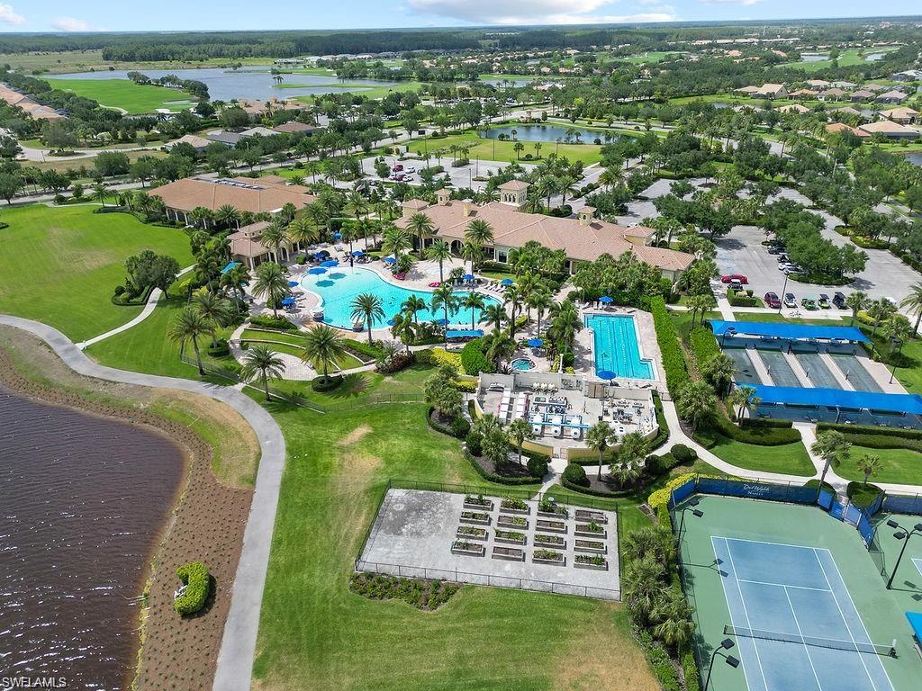 5931 Mayflower Way Ave Maria, FL 34142 - Photo 31 of 34 an aerial view of residential houses with outdoor space and pool