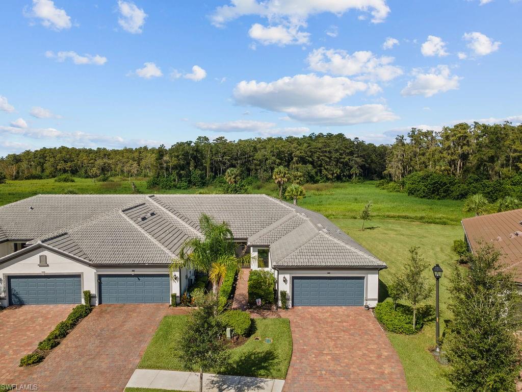 5931 Mayflower Way Ave Maria, FL 34142 - Photo 4 of 34 an aerial view of a house
