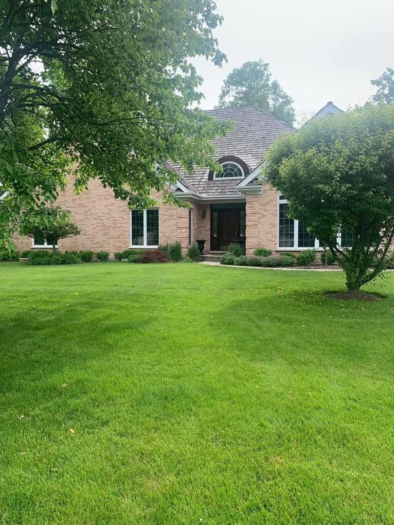 1347 Hillside Road Northbrook, IL 60062 - Photo 1 of 1 a front view of house with yard and green space