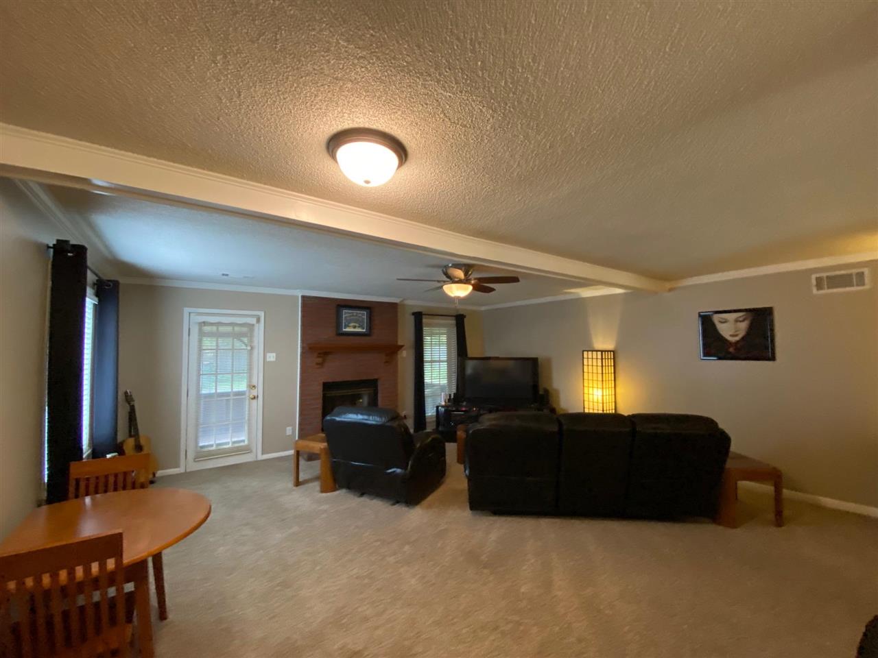 1265 Whitewater Road Memphis, TN 38117 - Photo 11 of 23 a living room with furniture and a flat screen tv