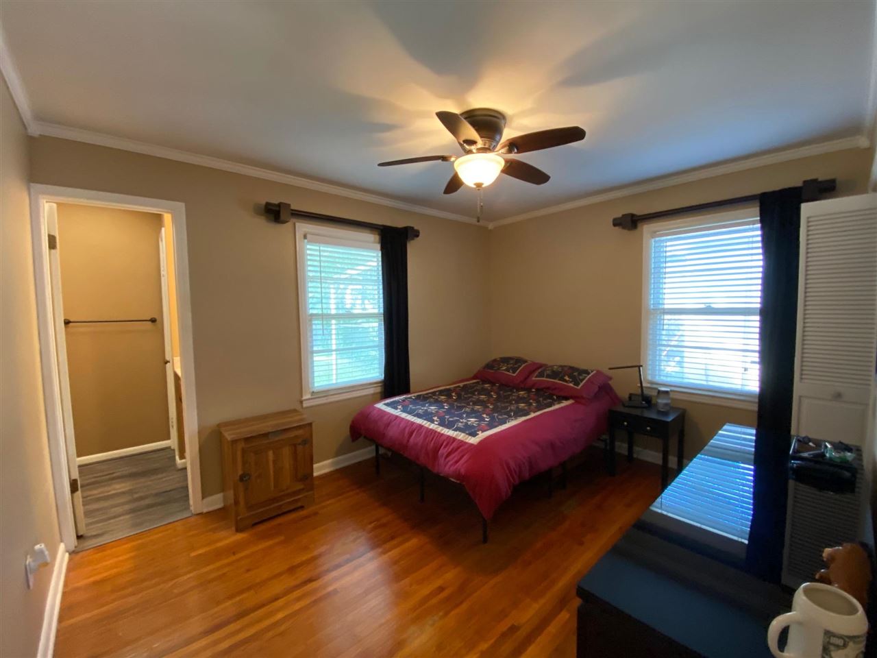 1265 Whitewater Road Memphis, TN 38117 - Photo 12 of 23 a bedroom with a bed and wooden floor