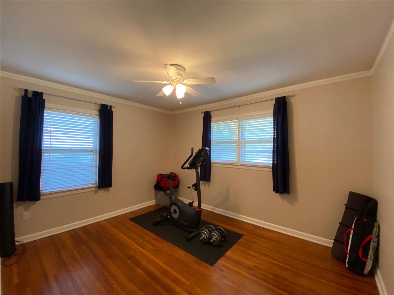 1265 Whitewater Road Memphis, TN 38117 - Photo 13 of 23 a view of workspace with wooden floor and fan