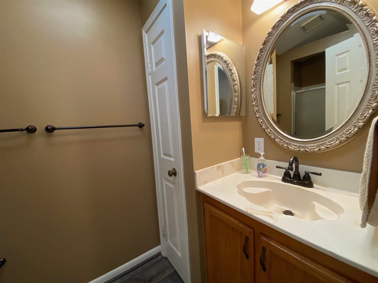 1265 Whitewater Road Memphis, TN 38117 - Photo 15 of 23 a bathroom with a sink and a mirror