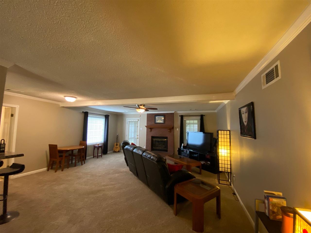 1265 Whitewater Road Memphis, TN 38117 - Photo 7 of 23 a view of a livingroom with furniture a ceiling fan and window