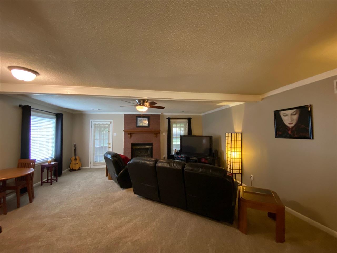 1265 Whitewater Road Memphis, TN 38117 - Photo 8 of 23 a living room with furniture and a flat screen tv