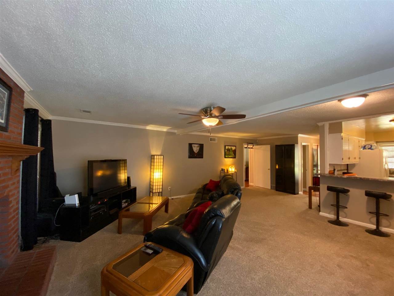 1265 Whitewater Road Memphis, TN 38117 - Photo 10 of 23 a living room with furniture and a flat screen tv