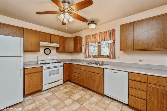 360 Mildred Avenue Cary, IL 60013 - Photo 11 of 18 a kitchen with stainless steel appliances granite countertop a sink and cabinets