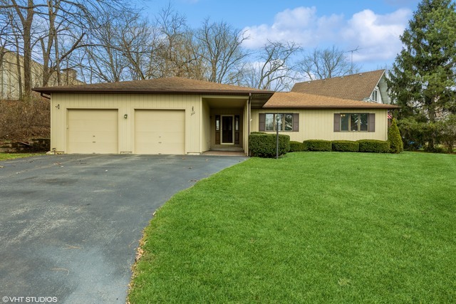360 Mildred Avenue Cary, IL 60013 - Photo 2 of 18 a view of a house with a garden
