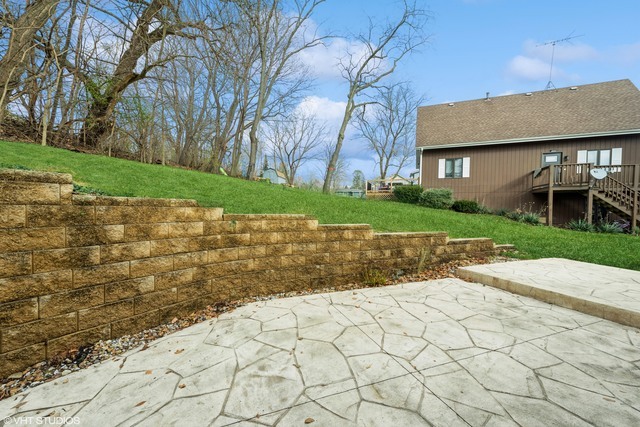 360 Mildred Avenue Cary, IL 60013 - Photo 5 of 18 a view of a brick house with a yard