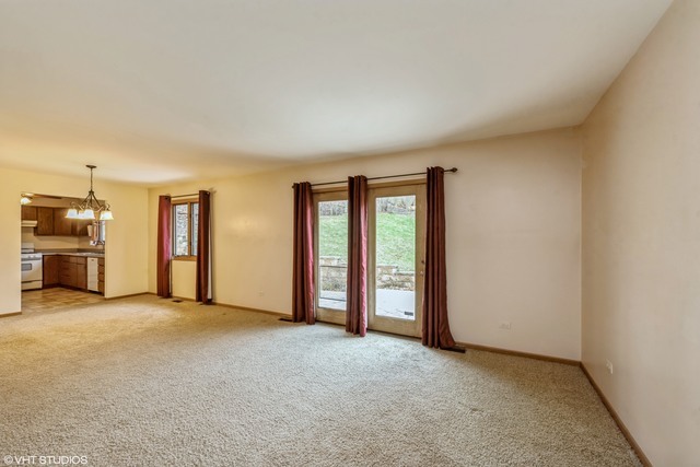 360 Mildred Avenue Cary, IL 60013 - Photo 7 of 18 an empty room with furniture and windows