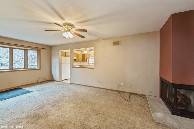 360 Mildred Avenue Cary, IL 60013 - Photo 10 of 18 an empty room with windows and fan