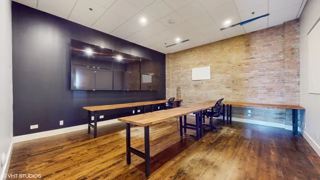 a workspace with furniture and wooden floor