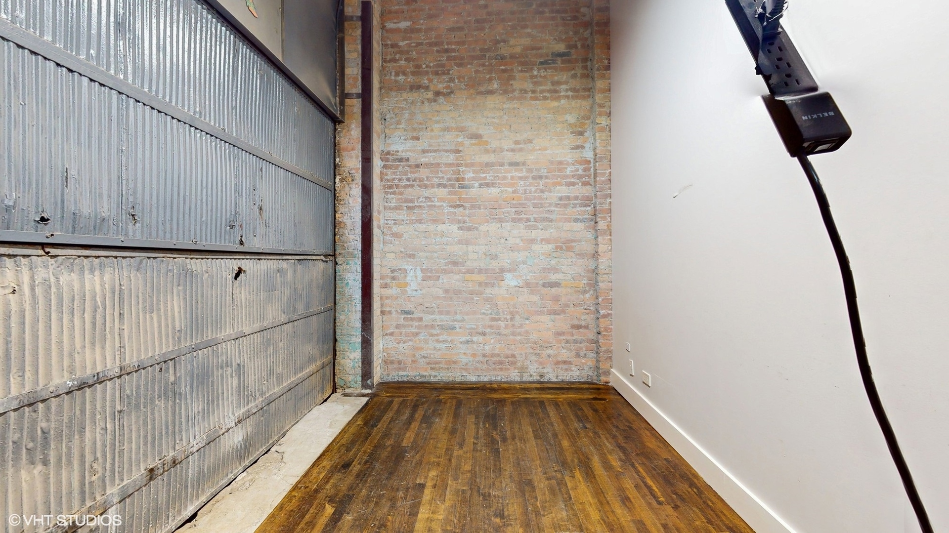 2241 South Wabash Avenue Chicago, IL 60616 - Photo 22 of 91 a view of walk in closet with wooden floor