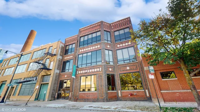 a view of an empty room with stairs and a ceiling fan