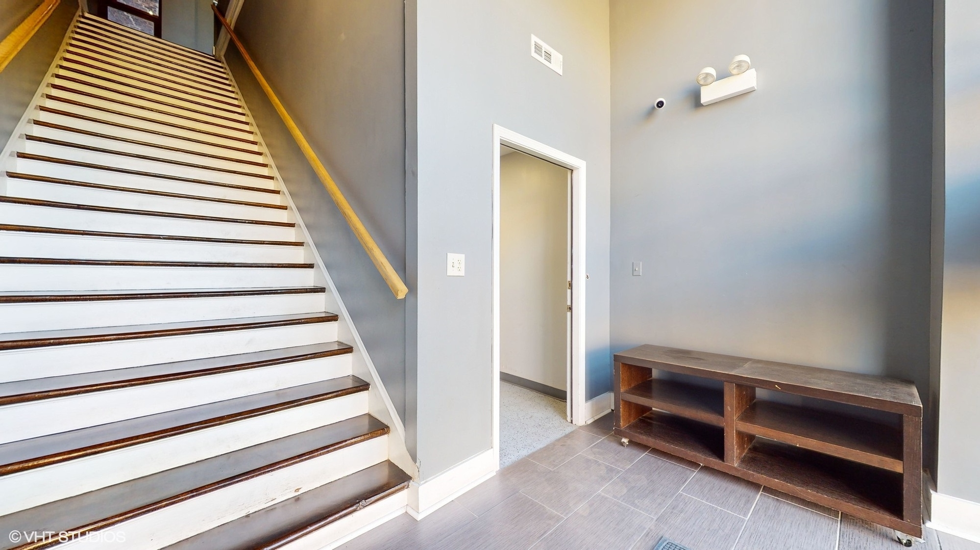 2241 South Wabash Avenue Chicago, IL 60616 - Photo 4 of 91 a view of an empty room with stairs and a ceiling fan