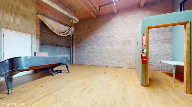 a view of empty room with wooden ceiling