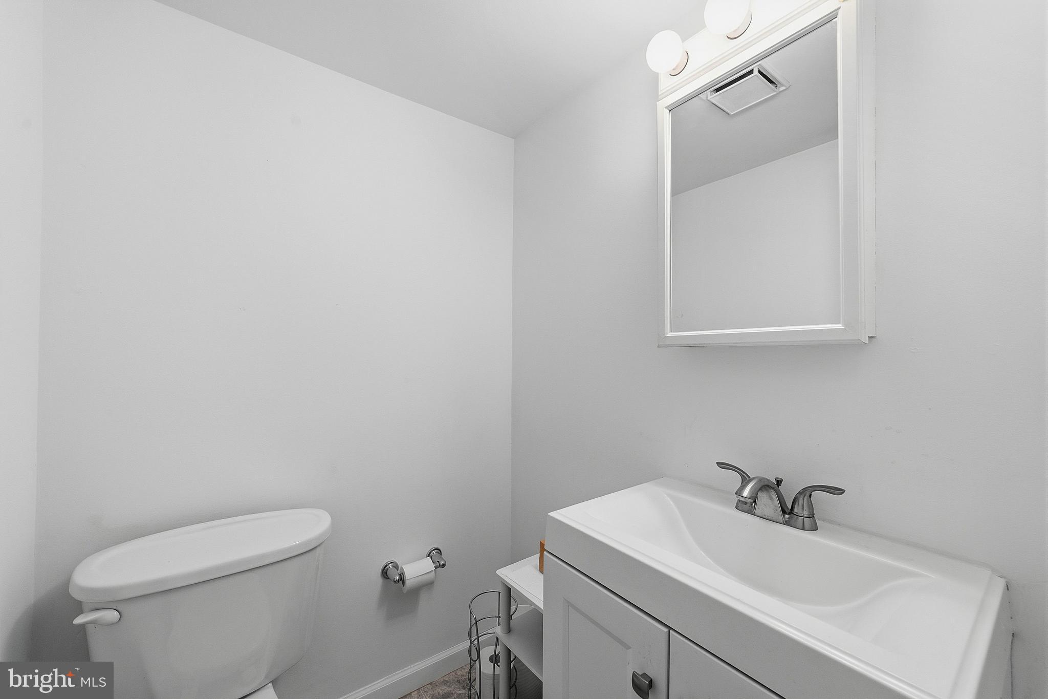 307 Hialeah Drive Cherry Hill, NJ 08002 - Photo 11 of 34 a bathroom with a sink a toilet and a mirror