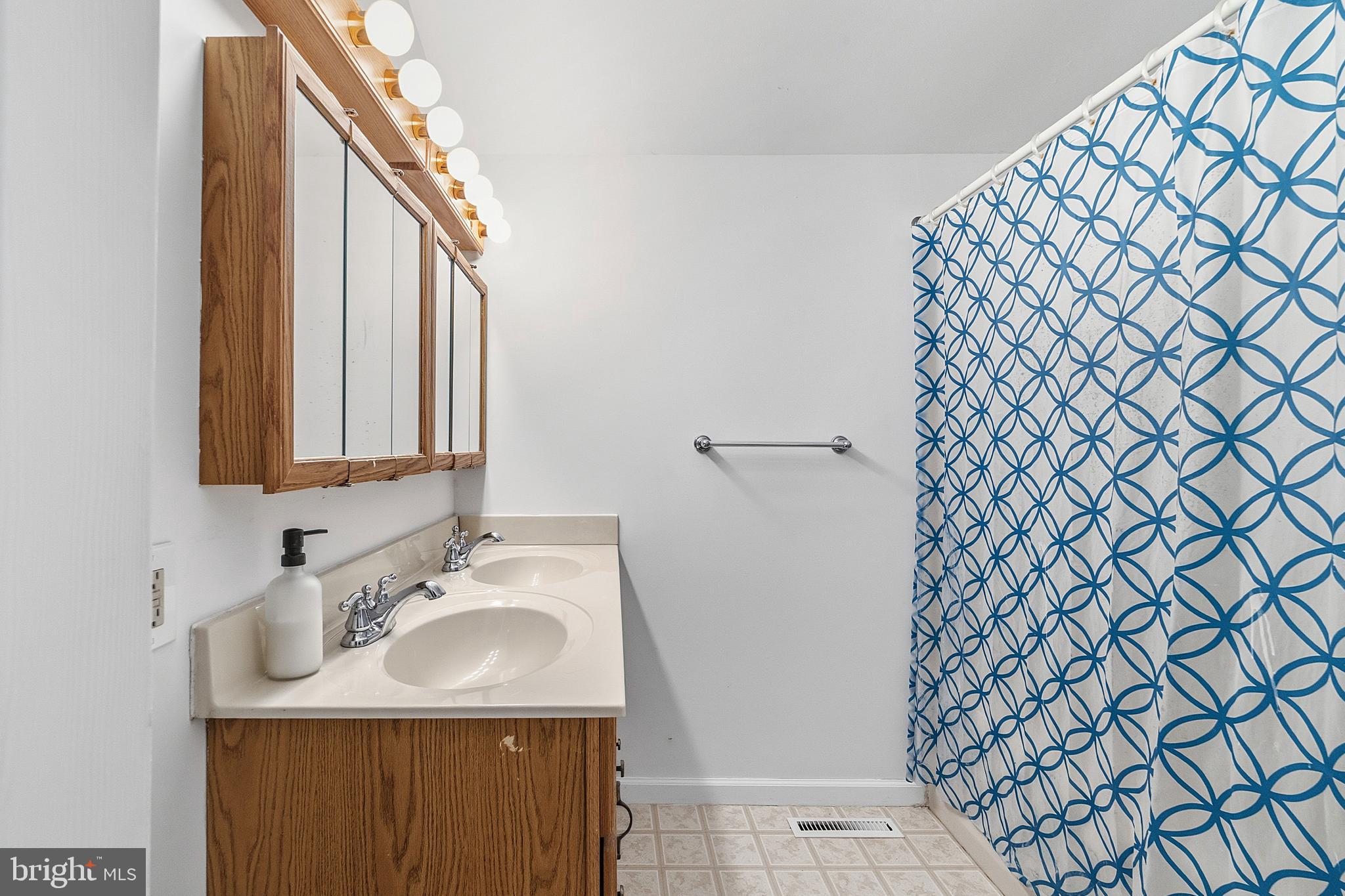 307 Hialeah Drive Cherry Hill, NJ 08002 - Photo 19 of 34 a bathroom with a sink and a mirror