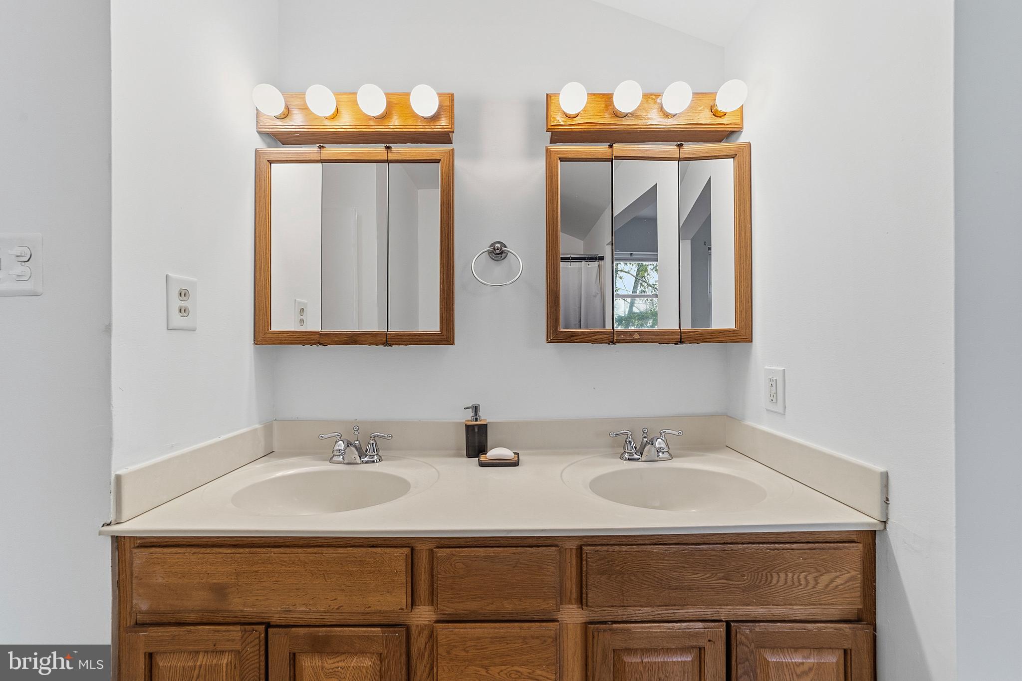 307 Hialeah Drive Cherry Hill, NJ 08002 - Photo 24 of 34 a bathroom with a sink and a mirror