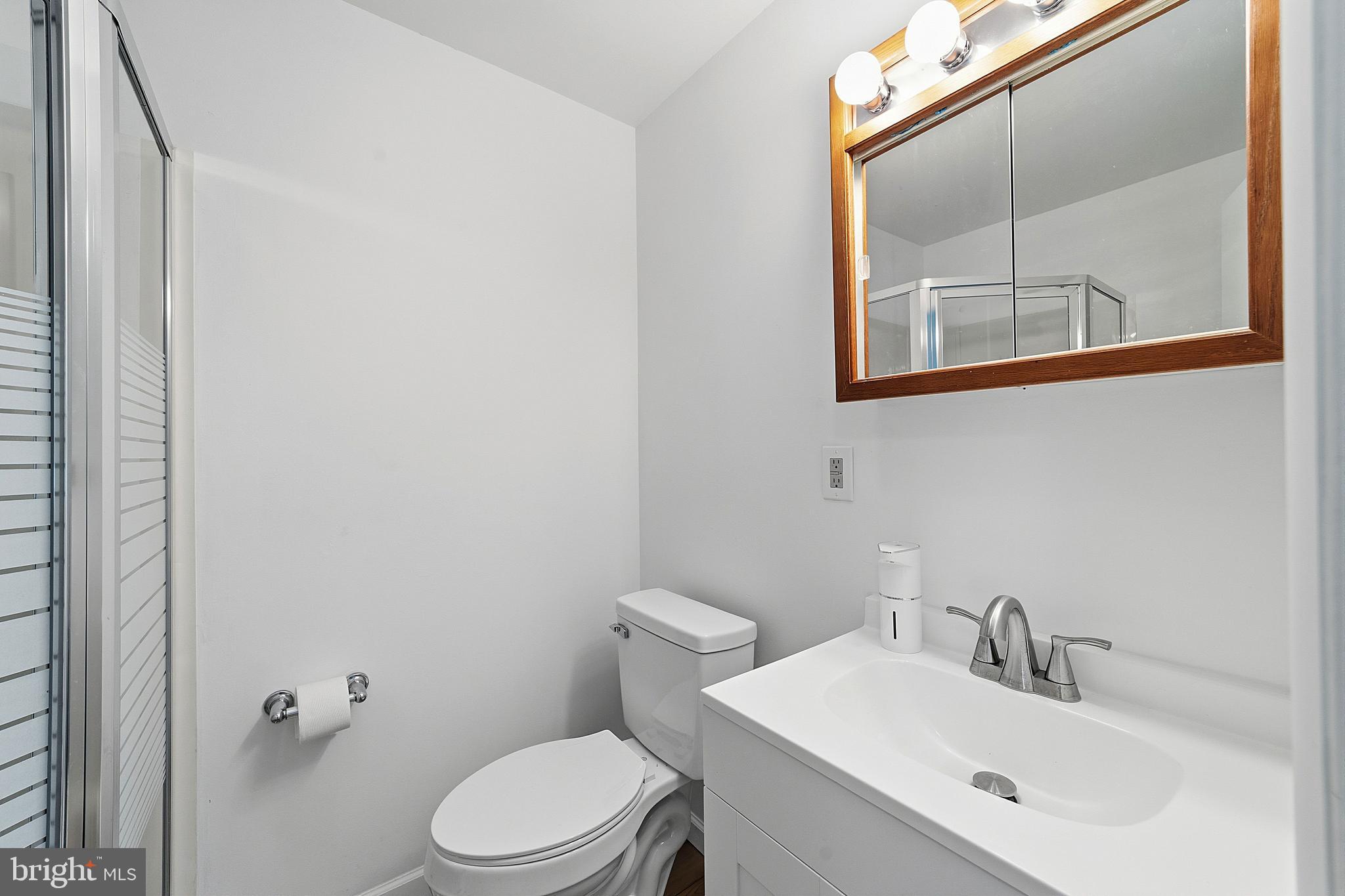 307 Hialeah Drive Cherry Hill, NJ 08002 - Photo 25 of 34 a bathroom with a sink mirror and toilet