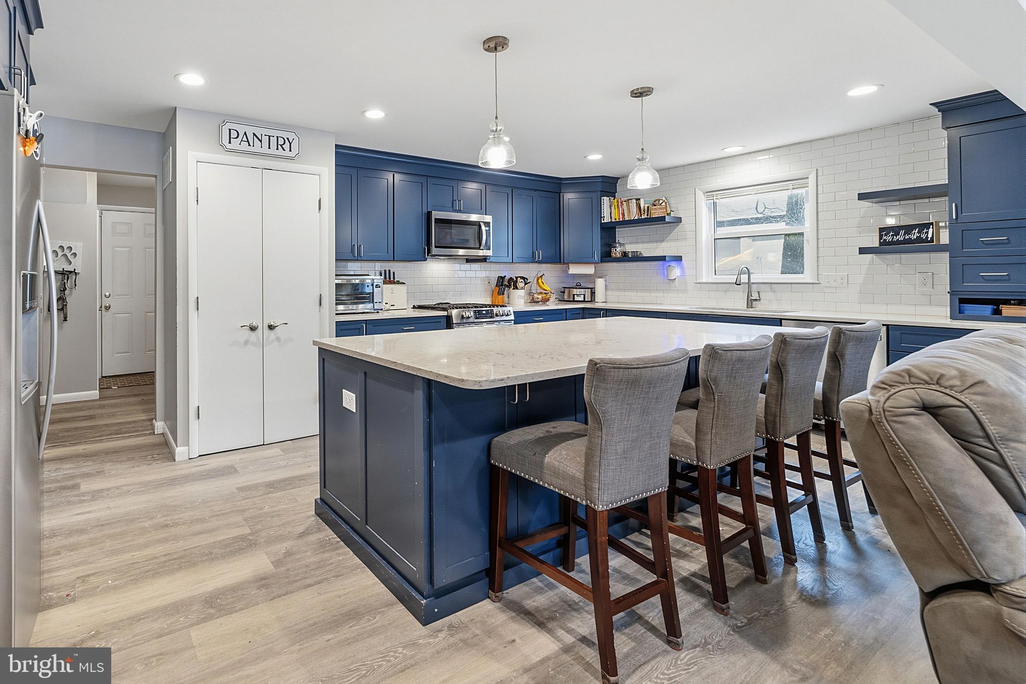 307 Hialeah Drive Cherry Hill, NJ 08002 - Photo 6 of 34 a large kitchen with kitchen island a dining table and chairs