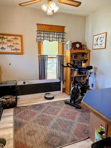 a bathroom with a granite countertop shower and a toilet