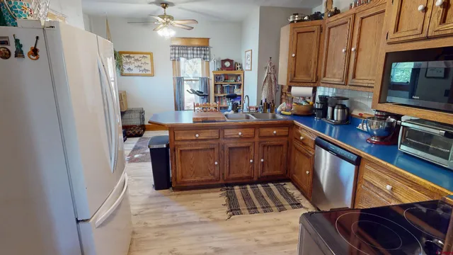 a living room with furniture and a chandelier