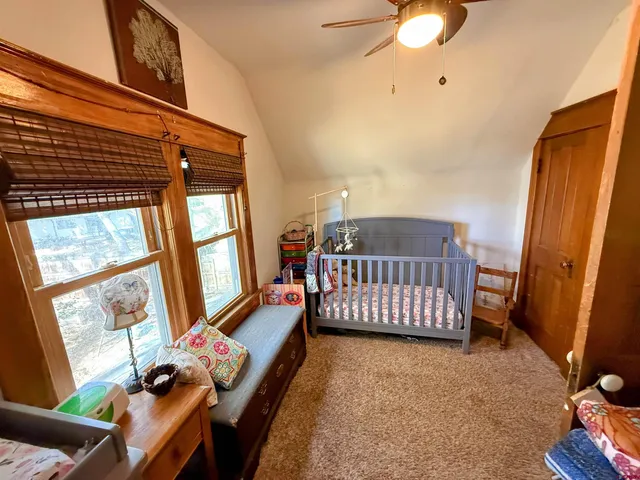 a bedroom with furniture and a window