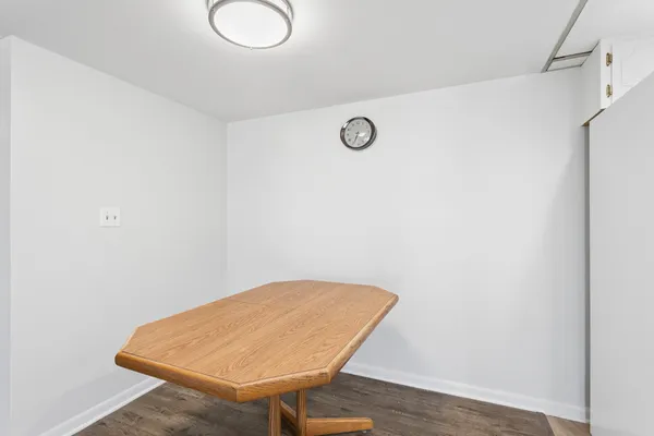 a view of a room with wooden floor