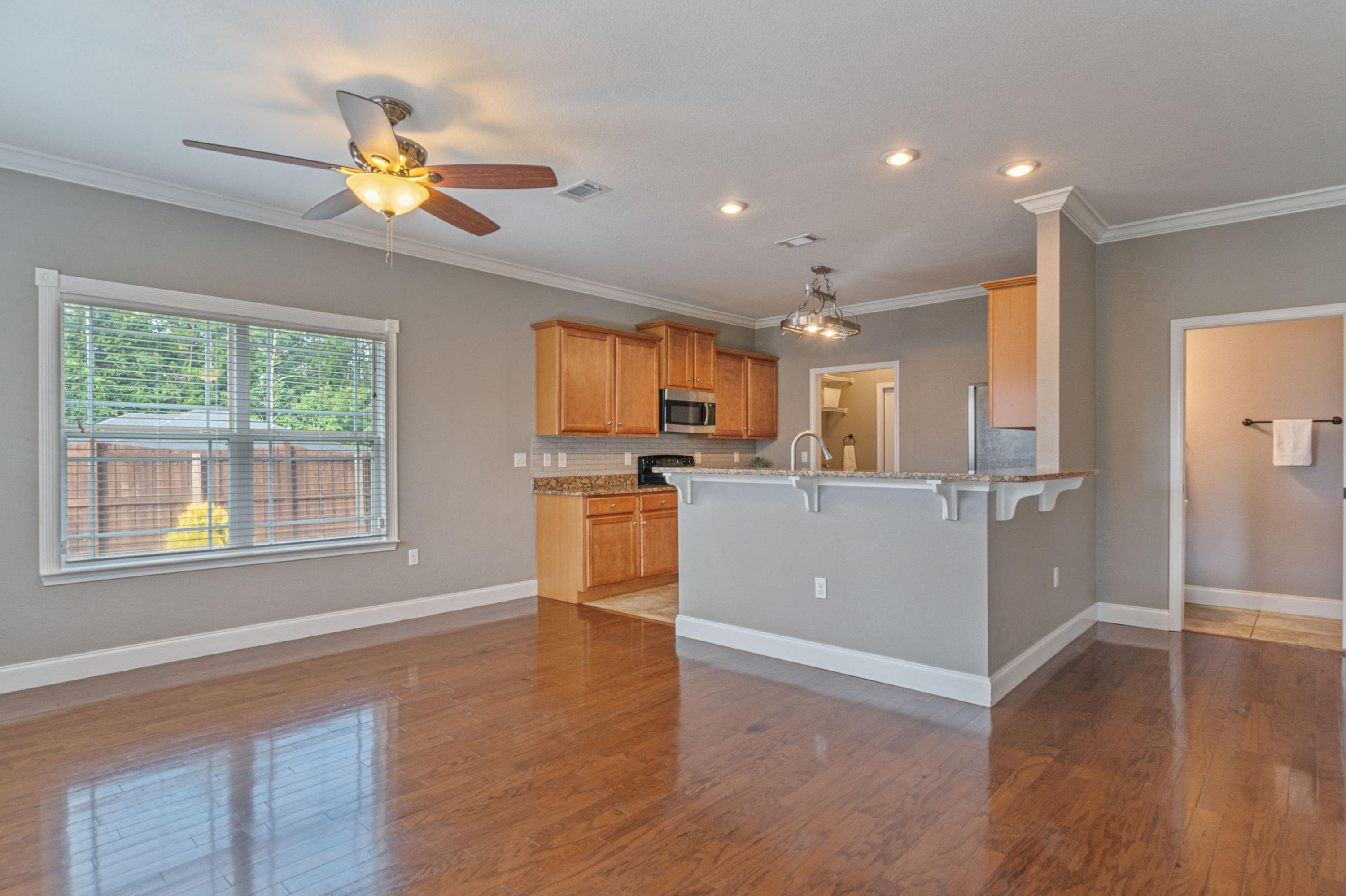4650 Hermosa Road Crestview, FL 32539 - Photo 8 of 32 a view of a kitchen with wooden floor and a window