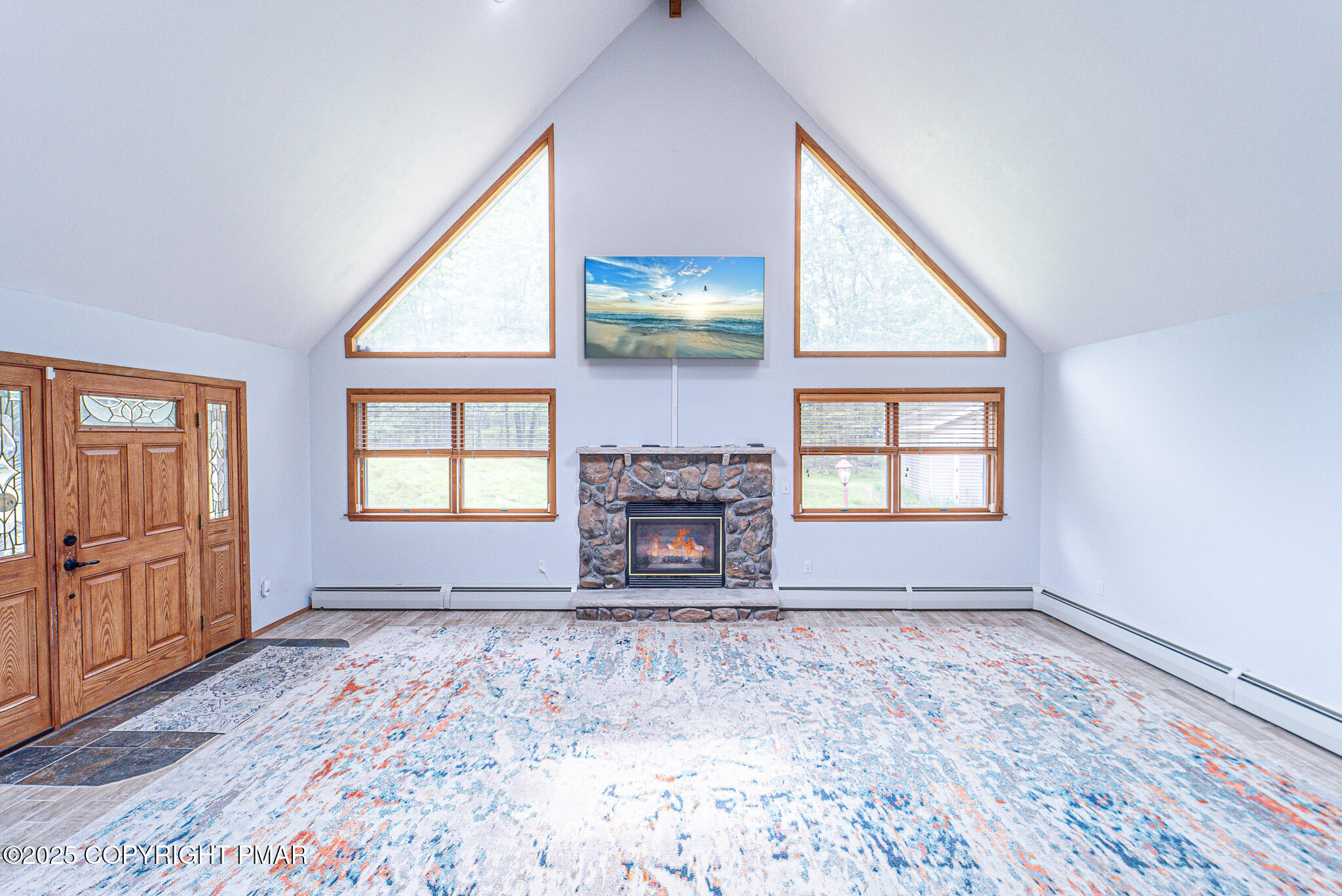 142 Bloss Road Canadensis, PA 18325 - Photo 17 of 109 an empty room with windows fireplace and windows