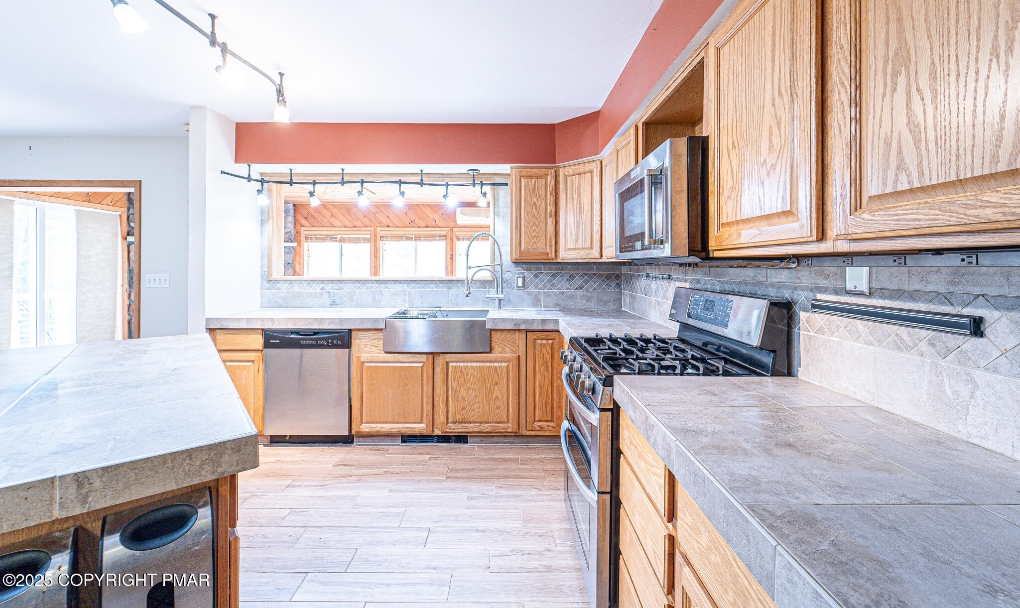 142 Bloss Road Canadensis, PA 18325 - Photo 25 of 109 a kitchen with stainless steel appliances granite countertop a stove a sink and a microwave