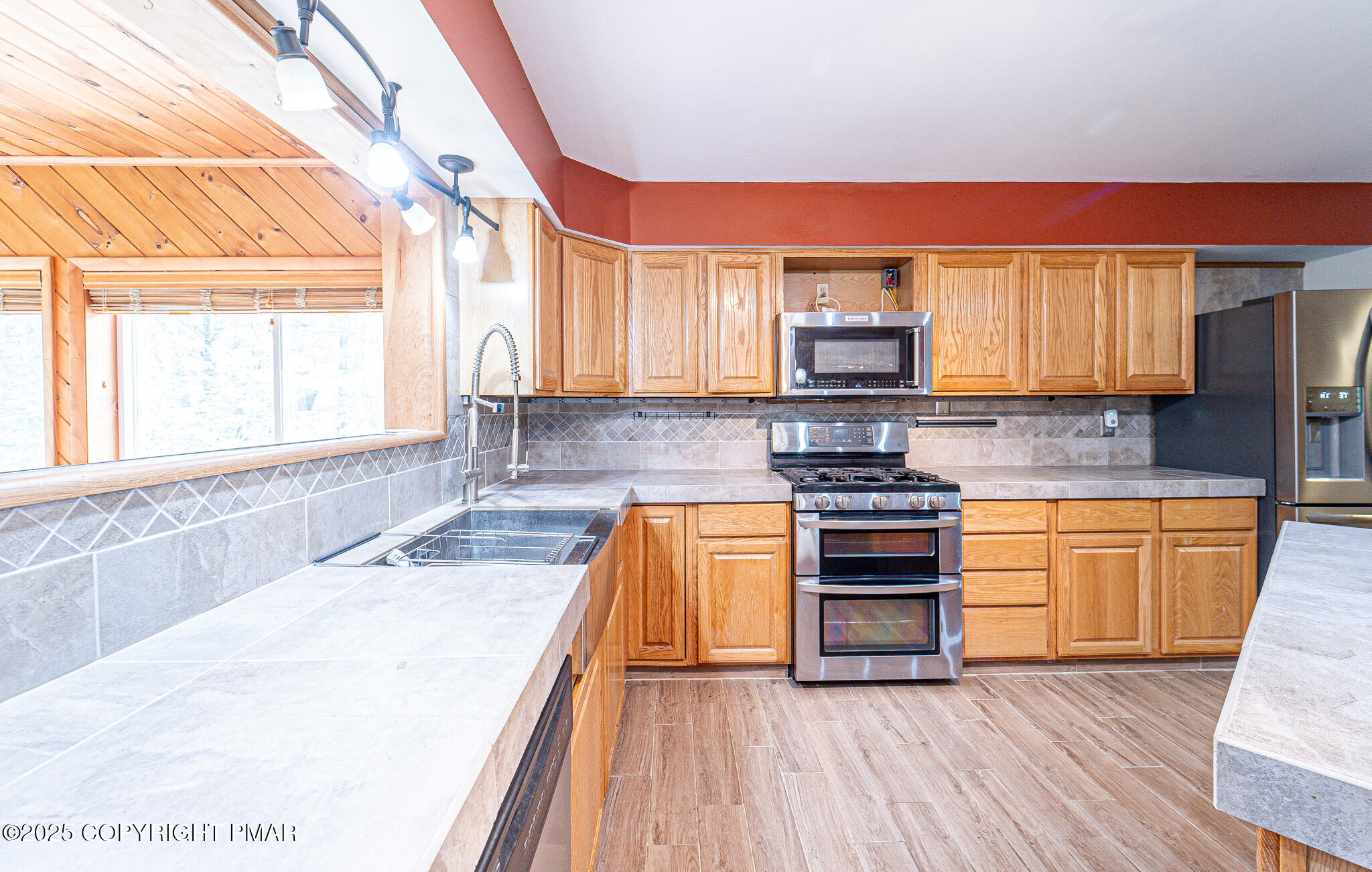 142 Bloss Road Canadensis, PA 18325 - Photo 26 of 109 a kitchen with granite countertop wooden floors and stainless steel appliances