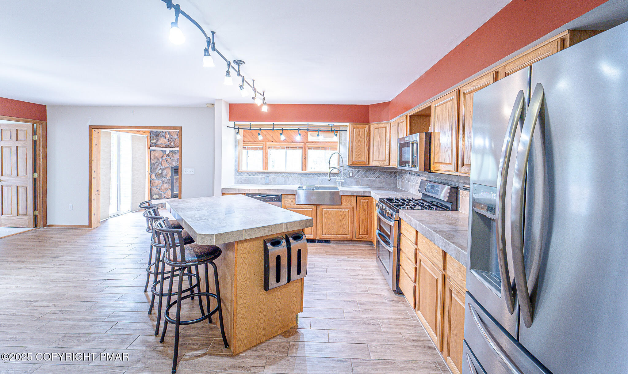 142 Bloss Road Canadensis, PA 18325 - Photo 27 of 109 a kitchen with stainless steel appliances granite countertop a stove top oven a sink and a refrigerator