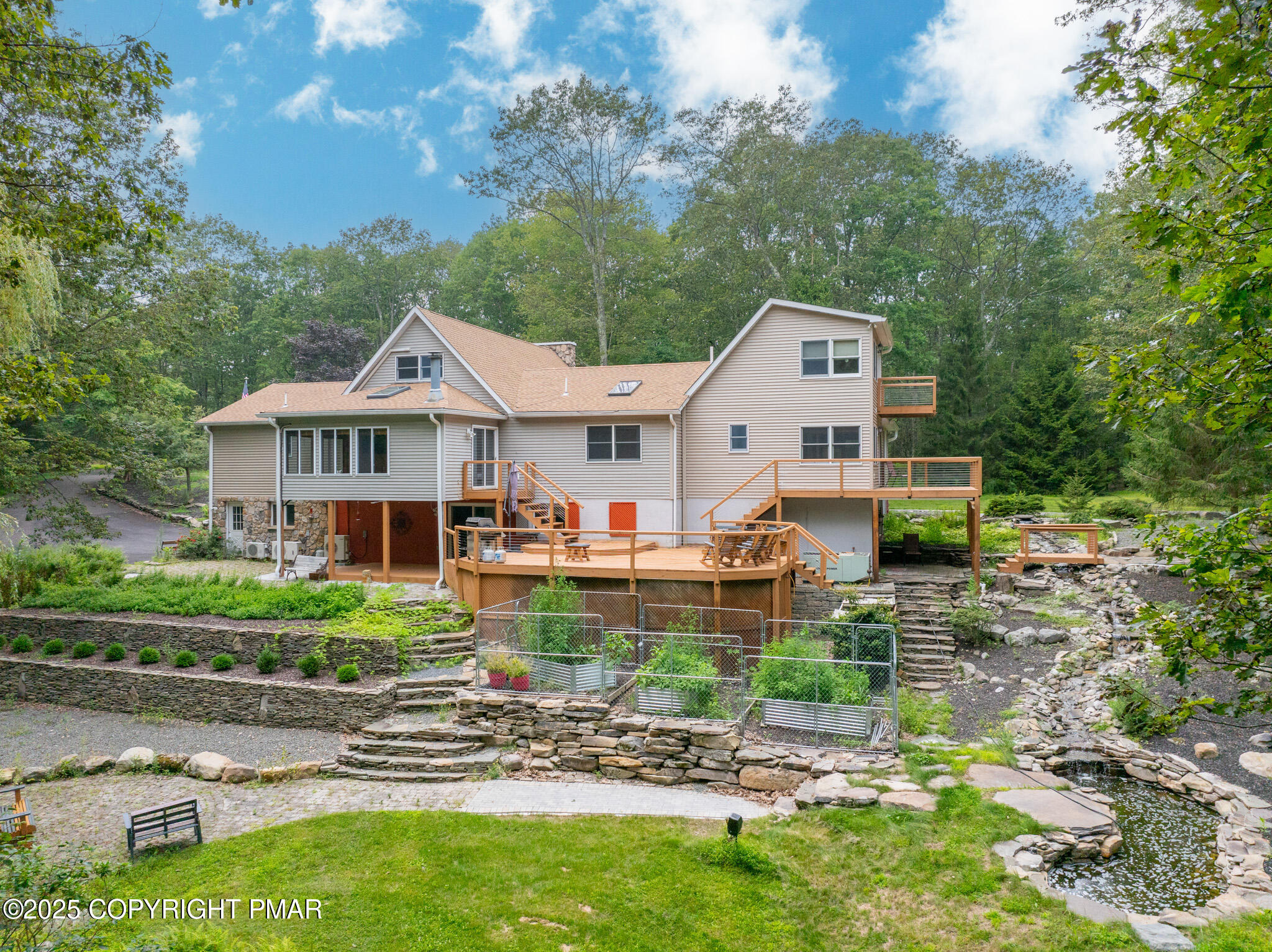 142 Bloss Road Canadensis, PA 18325 - Photo 3 of 109 a front view of a house with garden