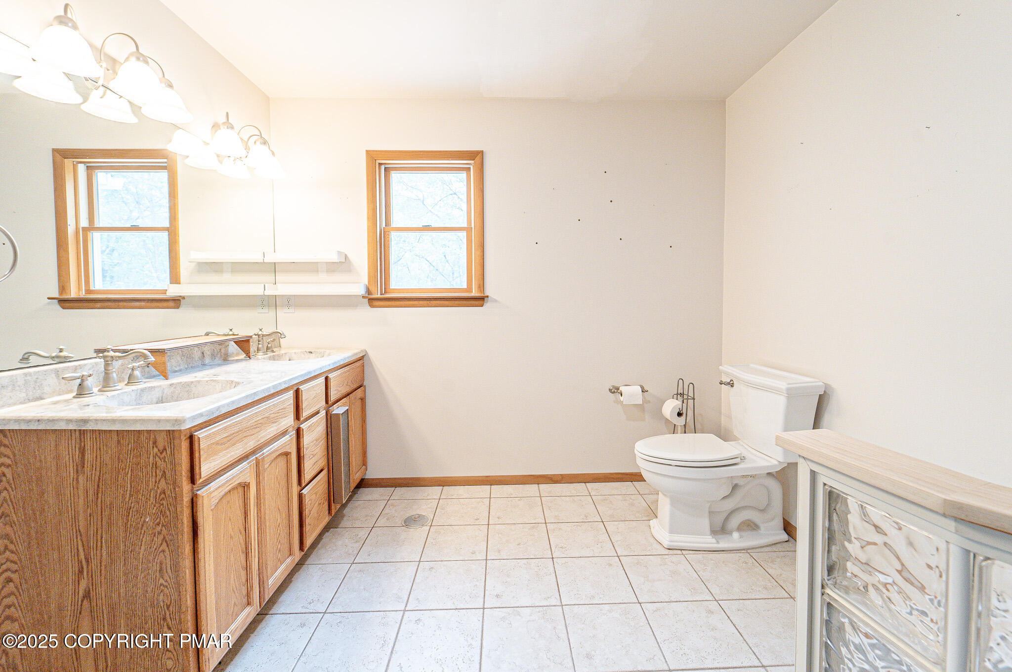 142 Bloss Road Canadensis, PA 18325 - Photo 52 of 109 a bathroom with a sink a toilet and a window