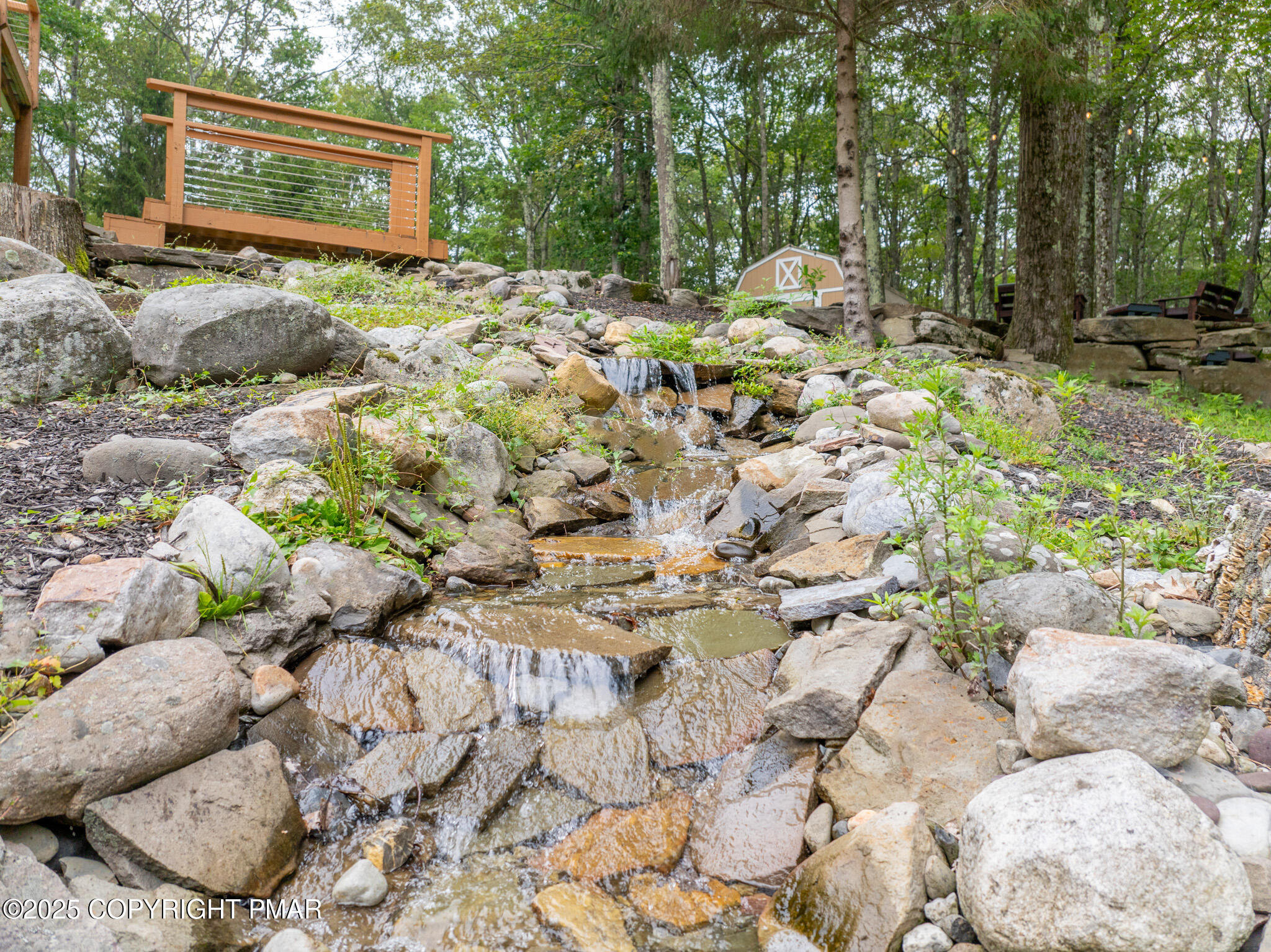 142 Bloss Road Canadensis, PA 18325 - Photo 98 of 109 a backyard of a house with large trees and plants