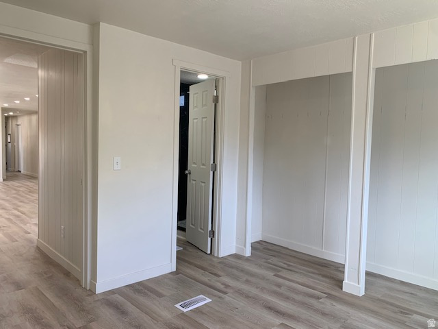 1500 North Angel Street West, Unit 56 Layton, UT 84041 - Photo 13 of 20 Unfurnished bedroom featuring light wood finished floors and baseboards