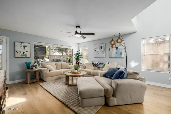 a living room with furniture and a large window