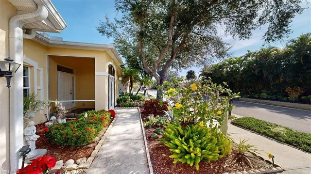 a view of a pathway with flower pots