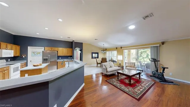 a living room with fireplace furniture and a flat screen tv