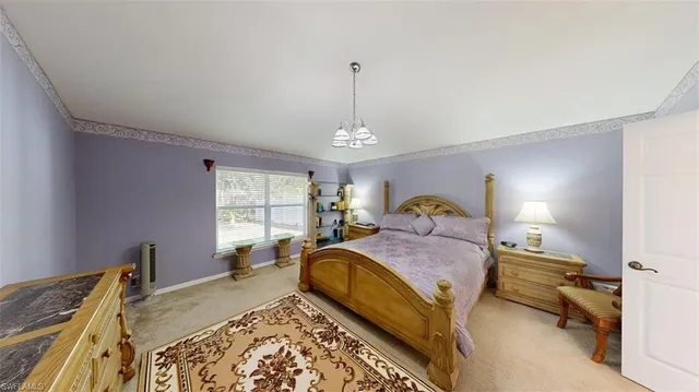 a bed room with a bed and a window