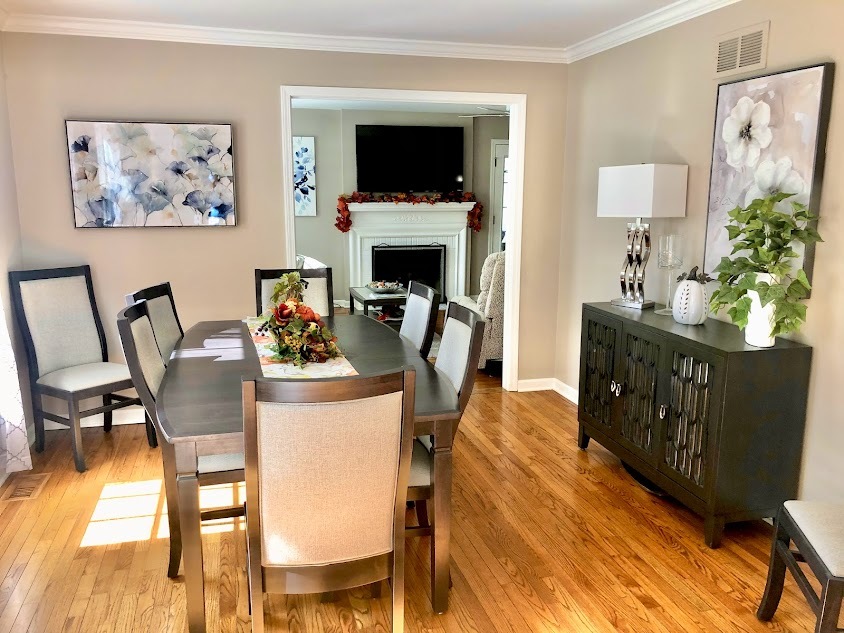 1603 Stonebridge Trail Wheaton, IL 60189 - Photo 12 of 33 a view of a dining room with furniture and a flat screen tv