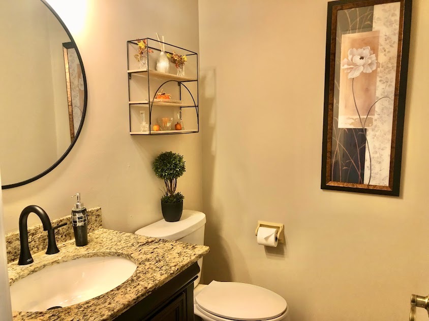 1603 Stonebridge Trail Wheaton, IL 60189 - Photo 15 of 33 a bathroom with a granite countertop toilet sink and mirror