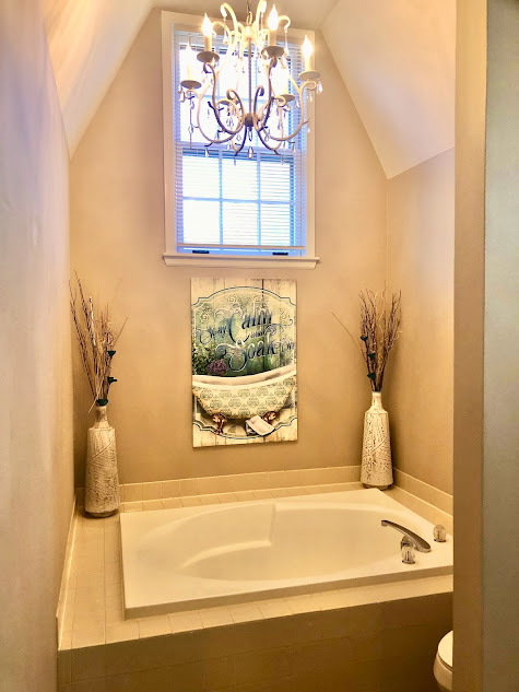1603 Stonebridge Trail Wheaton, IL 60189 - Photo 29 of 33 a bathroom with a bathtub and window