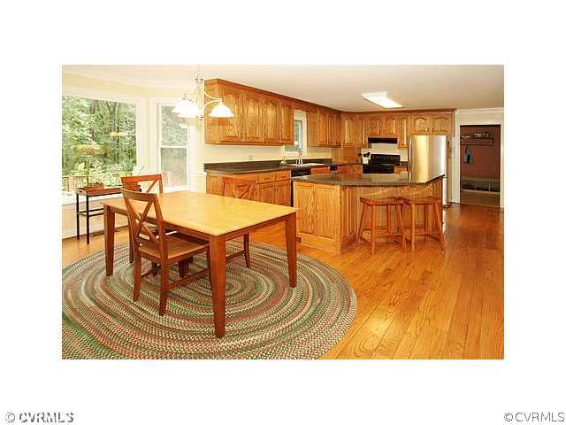 17182 White Pine Road Beaverdam, VA 23015 - Photo 2 of 12 a room with table chairs and a dining table
