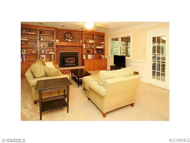 17182 White Pine Road Beaverdam, VA 23015 - Photo 3 of 12 a living room with furniture a flat screen tv and a fireplace