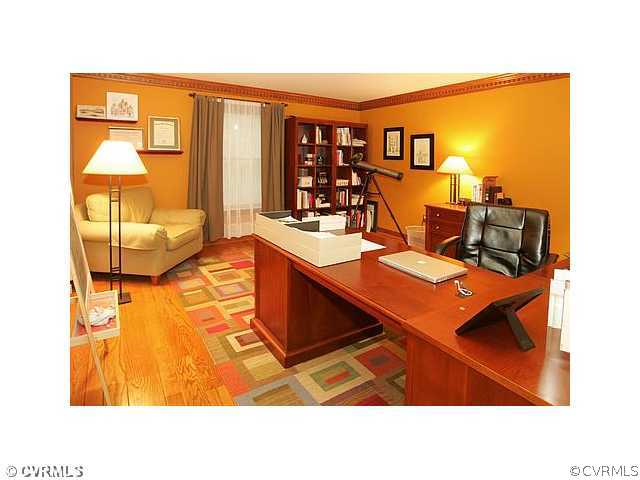 17182 White Pine Road Beaverdam, VA 23015 - Photo 5 of 12 a living room with furniture a flat screen tv and a floor